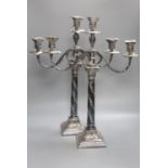 A pair of Georgian style plated two-branch three-light candelabra, height 53cm