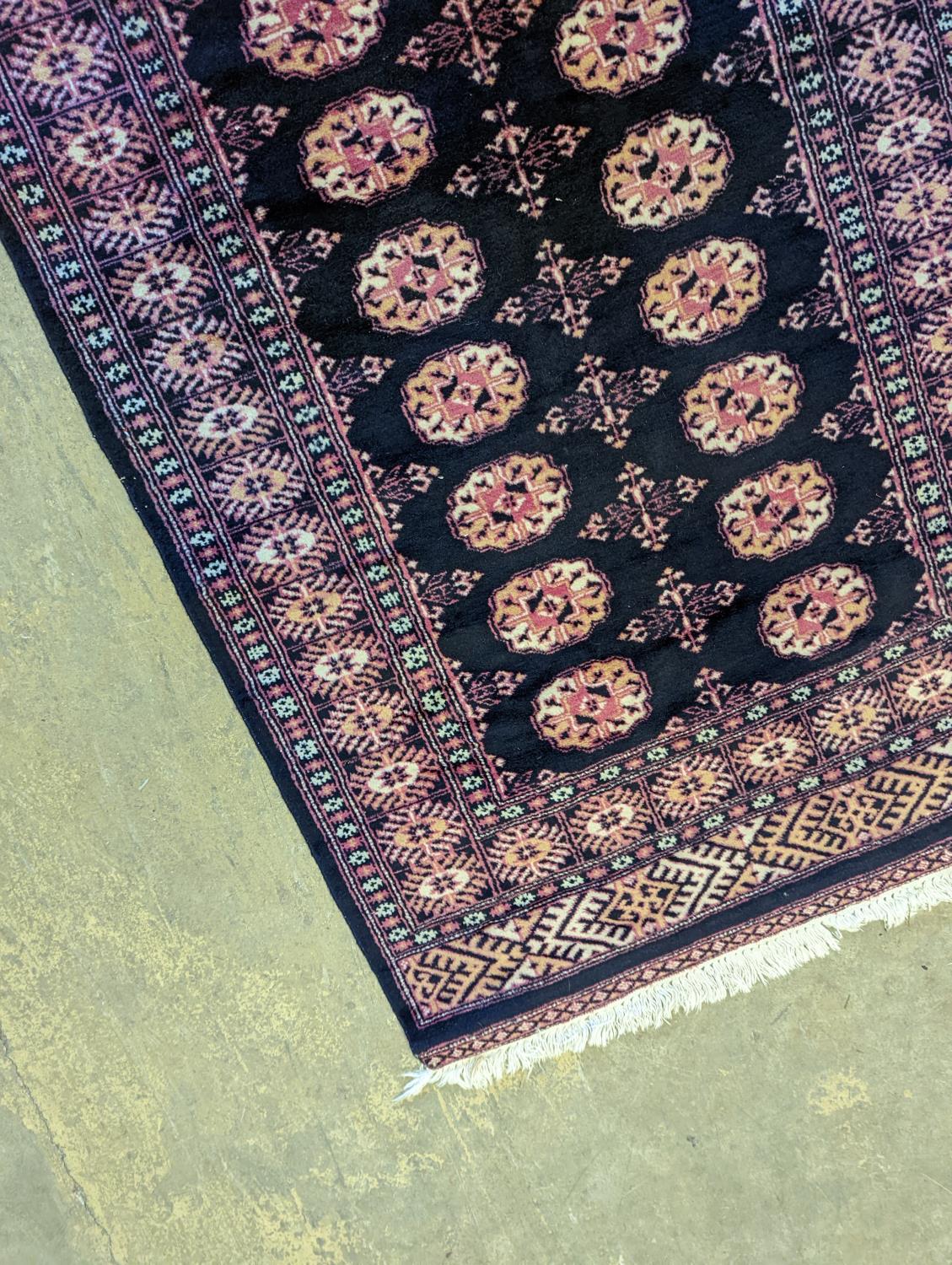 A Bokhara design blue ground rug, 160 x 98cm - Image 4 of 5