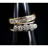 A 750 yellow metal and channel set nine stone diamond ring, size G, gross 2.6 grams and an early