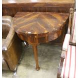 A 18th century Continental Goncalo Alves demi-lune card table with folding top, width 84cm, depth