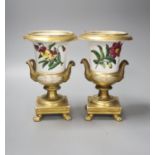 A pair of Paris porcelain flower painted campana urns, with receipt from 1928 £3.10, 20cm