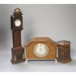 A late Georgian miniature longcase clock with pocket watch dial, puzzle coin box and mantel clock