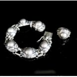 A Georg Jensen sterling bracelet, no. 57A, 18.5cm and a similar ring, no. 11A.