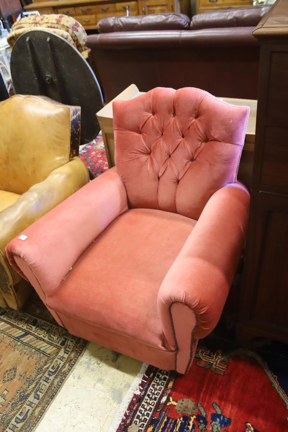 An early 20th century French armchair re-upholstered in pink dralon, width 86cm, depth 84cm,