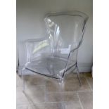 A perspex ghost chair, width 71cm height 98cm