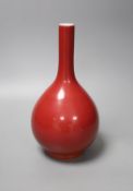 A Chinese red ground bottle vase, Qianlong mark but later 25cm