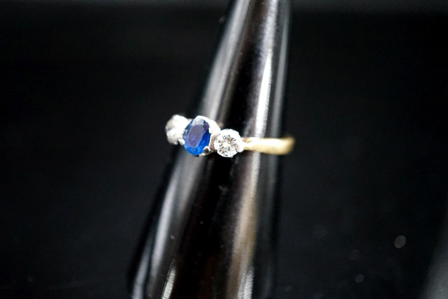 A modern 18ct gold, sapphire and diamond set three stone ring, size L/M, gross 3 grams. - Image 2 of 3