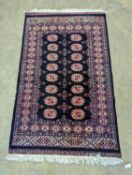 A Bokhara design blue ground rug, 160 x 98cm