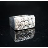 A 585 white metal and diamond cluster set tablet ring (stone missing), size N/O, gross 8.1 grams.