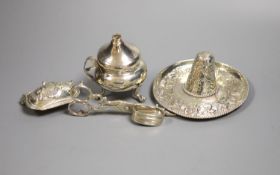 A sterling miniature sombrero and three other items, including candle snuffers and purse