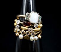 A 9ct and 'silver' white opal and gem set ring and four other thin shank yellow metal and gem set