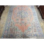 A North West Persian style faded wool carpet, 300 x 196cm