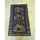 A Caucasian design blue ground rug, 145 x 84cm