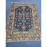 An antique Caucasian blue ground rug (worn), 200 x 148cm