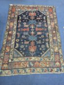 An antique Caucasian blue ground rug (worn), 200 x 148cm