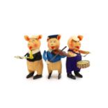 A set of three Schuco tinplate and felt clockwork pig musicians, pre war, tallest 11.5cm