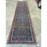 An antique Shirvan blue ground runner, 470 x 116cm