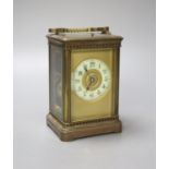 A French brass carriage clock with repeat, 18.5 cm high with the handle up