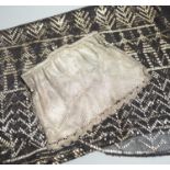 A vintage 1920's silver mesh evening bag, a black evening shawl woven with silver thread, length