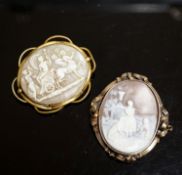 An Edwardian yellow metal mounted carved oval cameo shell and a gilt metal mounted cameo shell