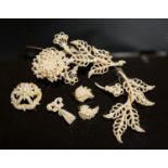 A 19th century seed pearl set flower brooch, 95mm and five other pieces of seed pearl jewellery.