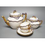 An early 20th century Richard Ginori gilt and blue ribbon decorated tea set