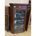 A George III and later mahogany astragal glazed hanging corner cabinet, width 77cm, depth 50cm,