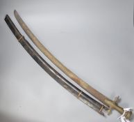 An Indonesian sword with brass handle, 19th century, blade stamped WARE Wd. CAST, in its ebony