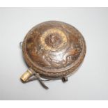 A circular wooden powder flask 17th century, carved with bear, hound and fox, and lion’s mask in low