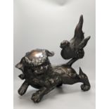 A large Chinese or Japanese bronze figure of a lion-dog or kara shi-shi, 45 cm long