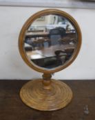 A Victorian gentleman’s telescopic walnut shaving mirror, with a stepped circular base, plate