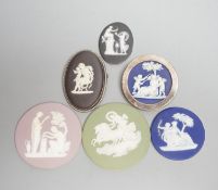 Two Wedgwood jasperware brooches, 20th century and four 19th century Wedgwood jasper plaques,