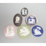 Two Wedgwood jasperware brooches, 20th century and four 19th century Wedgwood jasper plaques,