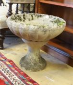 A circular reconstituted stone garden planter on stand, diameter 49cm, height 42cm