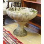 A circular reconstituted stone garden planter on stand, diameter 49cm, height 42cm