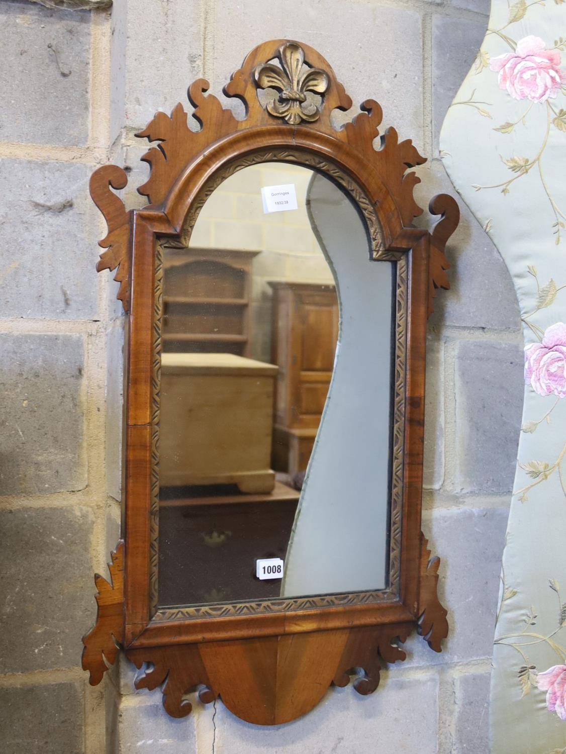 A George III style walnut fret cut and carved giltwood wall mirror, width 49cm, height 86cm