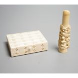 A Chinese ivory cigarette case, 8 x 6cm, and a Chinese carved ivory cheroot holder