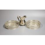 A Continental 800 standard silver cream jug, and a pair of 800 standard wine coasters, 13.6cm, gross