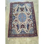 A North West Persian style ivory ground rug, 154 x 106cm