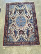 A North West Persian style ivory ground rug, 154 x 106cm