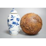 A Chinese blue and white jar and cover, Kangxi period, height 12cm and a Chinese ball