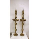 A pair of Benares engraved brass floor lamps 89cm