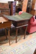 A Victorian mahogany writing/work table with twin hinged flap top, width 42cm, depth 50cm, height
