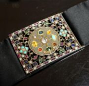 An Indian multi gem set belt buckle, mounted on a black sash belt, buckle 8cm.