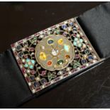 An Indian multi gem set belt buckle, mounted on a black sash belt, buckle 8cm.