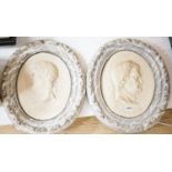 A decorative pair of faux marble portrait reliefs of Roman emperors 38cms