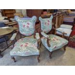 A pair of late Victorian mahogany upholstered drawing room chairs
