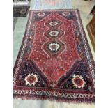A North West Persian red ground carpet, 335 x 220cm