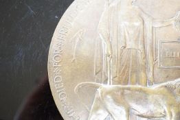 A WWI bronze death plaque to Ellis Woodley