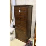 A modern hardwood seven drawer tall chest, width 63cm, depth 48cm, height 152cm